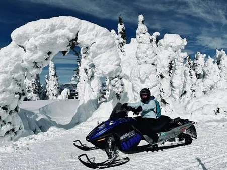 Snowmobiling on trails near Island Park Idaho