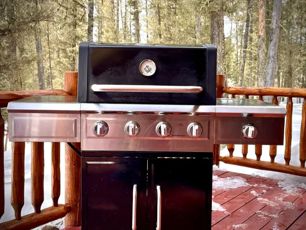 Outdoor BBQ grill and dining area on the deck