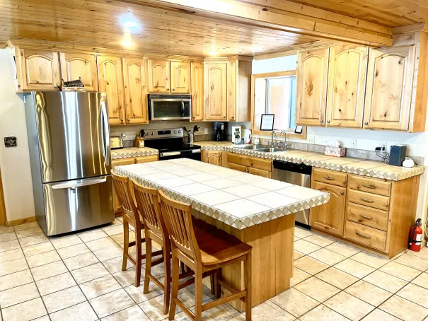 Fully equipped modern kitchen with stainless steel appliances