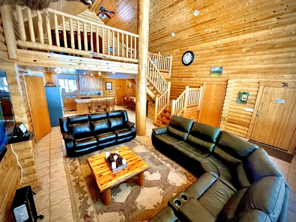 Breathtaking wooded views from the spacious living room with 2.5-story windows that bring nature inside