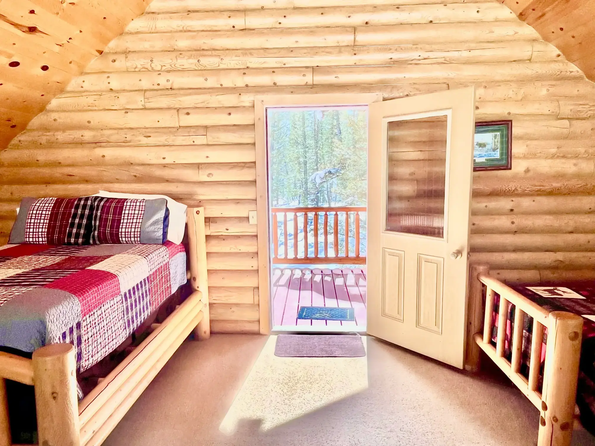 Loft bedroom with a double bed and two twin beds, perfect for families or groups