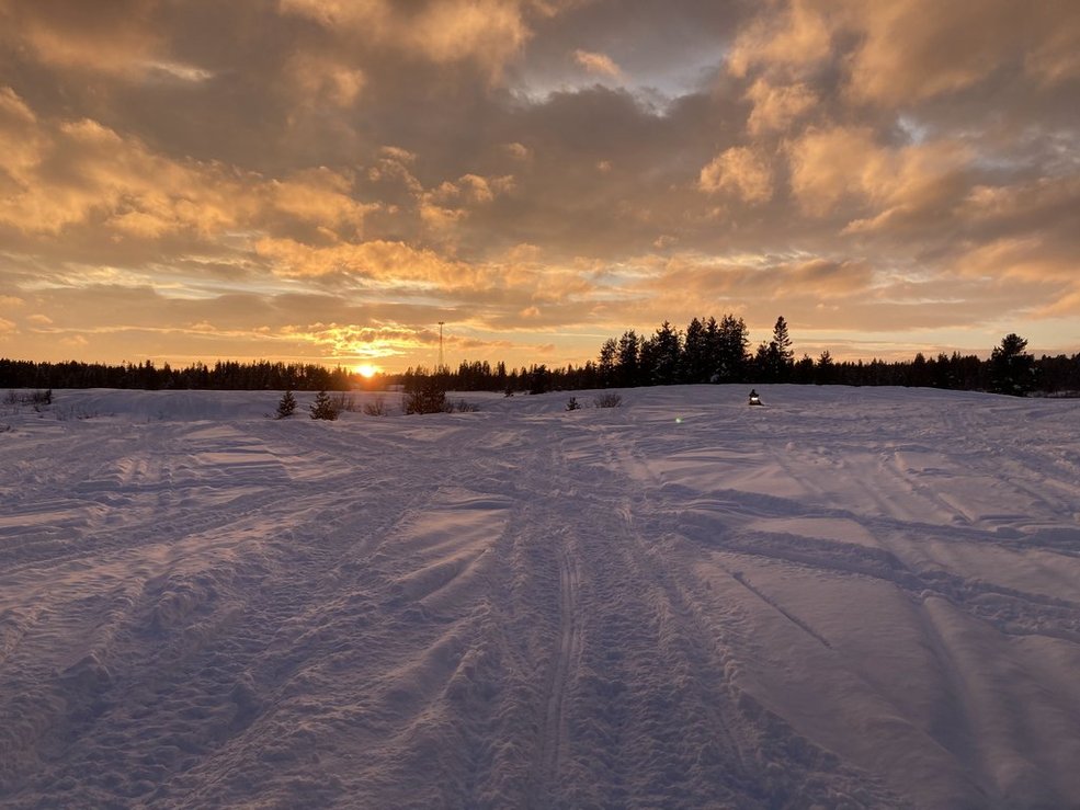 Snowmobile at sunset in Island Park